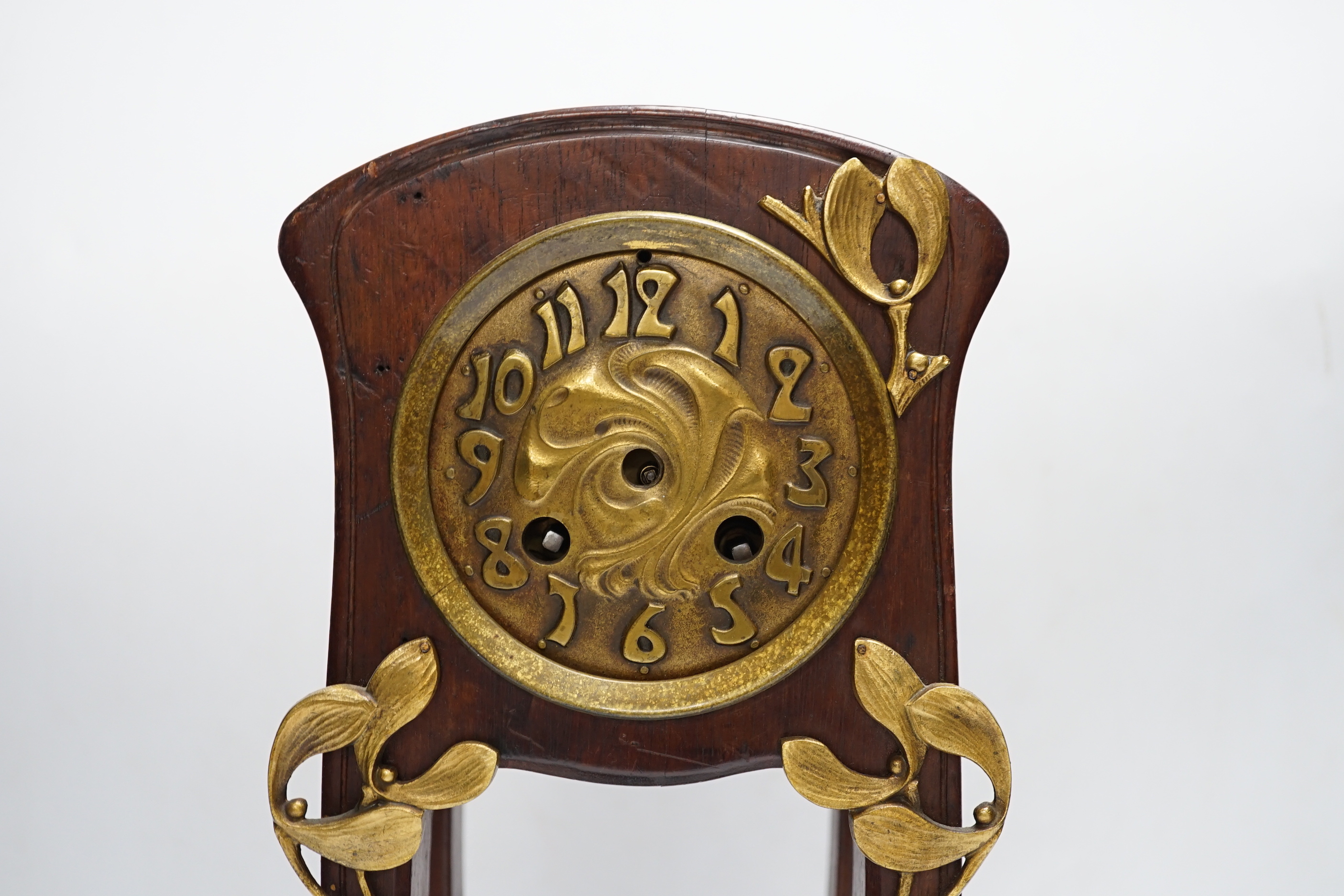 A French Art Nouveau mahogany and brass-mounted mantel clock, 39cm